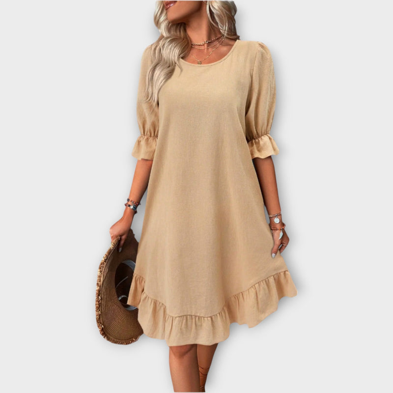 Abito con spalline sottili e linea elegante
